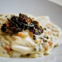 Four Cheese Ravioli · sage butternut squash, brown butter, parmesan, capers, crispy brussels sprout leaves
