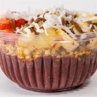 Chocotella Acai Bowl · Acai base, granola, banana, strawberry, pineapple, honey, nutella, coconut flakes.