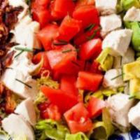 Cobb Salad · Grilled chicken over romaine lettuce with bacon, avocado, hard boiled egg, tomato and crumbl...