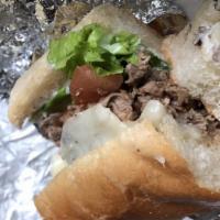 Longhorn · Grilled chopped steak with melted Mozzarella cheese, lettuce, tomato and horseradish mayo on...