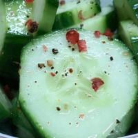 Cucumber Salad · quick marinaded, sliced Persian cucumbers in our house made vinaigrette