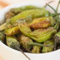 Shishito Peppers · quick blistered, smokey shishito peppers tossed in our house made seasoning