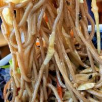 Cold Soba Noodle Salad · Japanese soba noodles, tossed with a medley of julienned vegetables and our house made sesam...