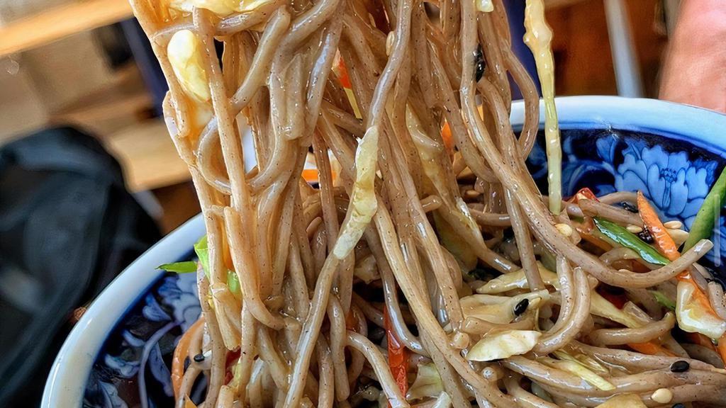 Cold Soba Noodle Salad · Japanese soba noodles, tossed with a medley of julienned vegetables and our house made sesame dressing