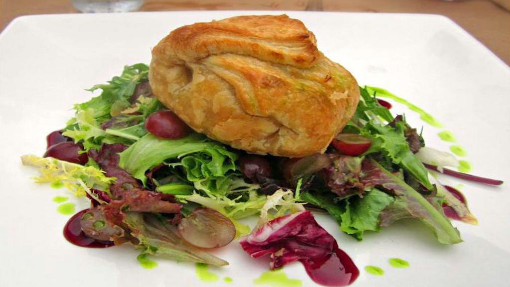 Warm Baked Brie · Puff Pastry with Apples, Organic Greens, Red Seedless Grapes, Raspberry Coulis