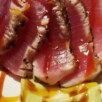 Seared Rare Tuna Appetizer · Seaweed Salad, Avocado, Pickled Cucumber, Plum Sweet Soy Emulsion
