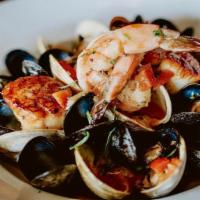 Thyme Paella · Jumbo Shrimp, Mussels, Clams, Scallops, Chorizo,
Saffron Risotto, Lobster Tarragon Broth