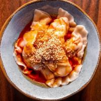 Sichuan Pork Dumplings红油水饺 · Little spicy. Served with roasted chili vinaigrette.