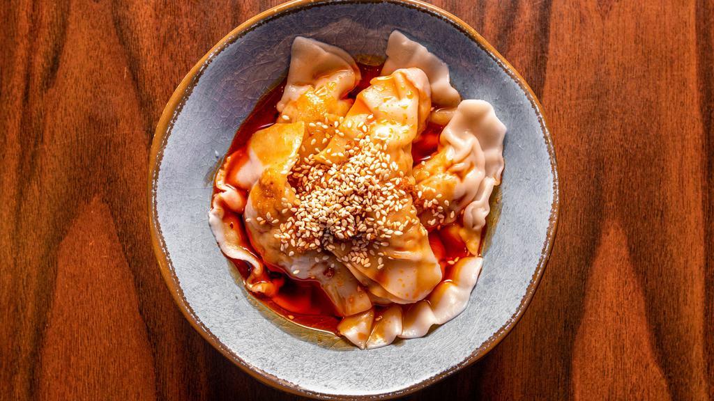 Sichuan Pork Dumplings红油水饺 · Little spicy. Served with roasted chili vinaigrette.