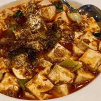 Ma Po Tofu麻婆豆腐 · Medium spicy. Soft tofu and minced pork with spicy hot bean paste sauce.