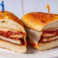 Chicken Parm Sandwich · Fried chicken, melted mozzarella, tomato sauce on a garlic club roll. Add fries for a small ...