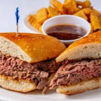 French Dip Sandwich · Shaved prime slow cooked roast beef dipped in au jus on a hero with horseradish sauce and au...