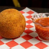 Sicilian Style Rice Ball (Ea) · Stuffed with ground beef, green peas and fresh mozzarella. Served with marinara sauce.