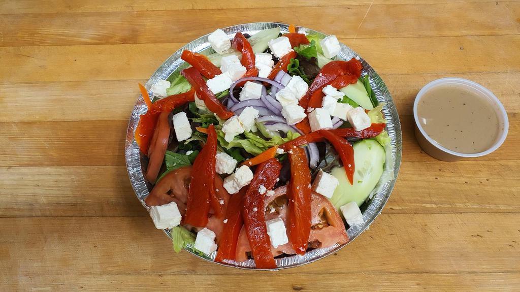 Greek Salad · Mixed greens, tomato, cucumbers, fresh red peppers, red onions, olives and feta cheese.