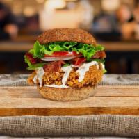 Bacon Of Hope Fried Chicken Sandwich · Crispy fried chicken, crispy bacon, lettuce, onion, tomatoes, and house mayo. Served on a wa...