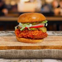 Naughty Nashville Fried Chicken Sandwich · Crispy fried chicken, sliced tomatoes, shredded lettuce, jalapenos, and nashville hot sauce....