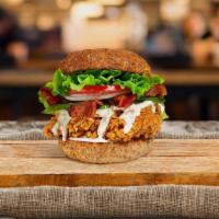 Bacon Avolution Fried Chicken Sandwich · Crispy fried chicken, sliced avocado, crispy bacon, lettuce, tomatoes, and house mayo. Serve...
