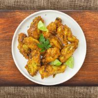 Dapper Lemon Pepper Wings · Fresh chicken wings breaded, fried until golden brown, and tossed in lemon pepper sauce. Ser...