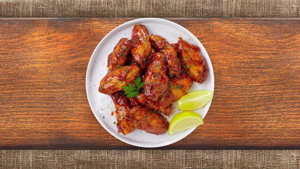 Sweet Sizzle Wings · Fresh chicken wings breaded, fried until golden brown, and tossed in honey and barbecue sauce. Served with a side of ranch or bleu cheese.