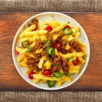 Load It Up Fries · Idaho potato fries cooked until golden brown and garnished with shredded bacon, diced beef h...