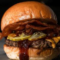 Smokehouse Bbq Bacon Cheeseburger · Fresh ground beef seasoned seared and topped with crispy bacon, American cheese, caramelized...