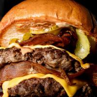 Munchie Buster Burger · Triple stacked burger made from fresh ground beef seared and served with choice of burger st...