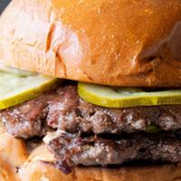 Double Burger · Two perfectly grilled patties, caramelized onions, pickles, burger sauce on a toasted brioch...