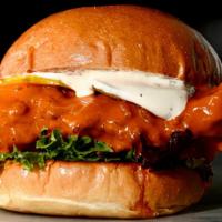 Buffalo Chicken Sandwich · Our famous Fried Chicken tossed in buffalo wing sauce, topped with pickles, mixed greens and...