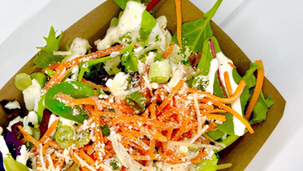 Combo Salad · Basic house salad consisting of mixed greens, buttermilk ranch, carrots, parmesan and green onions.