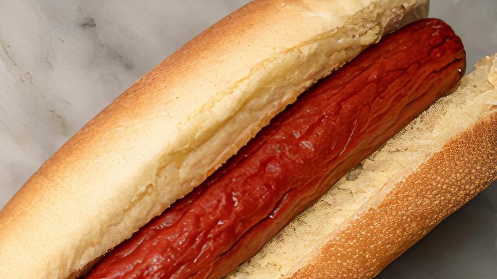 Home Dog · Potato roll with a Feltman's hot dog and condiment packets on the side.