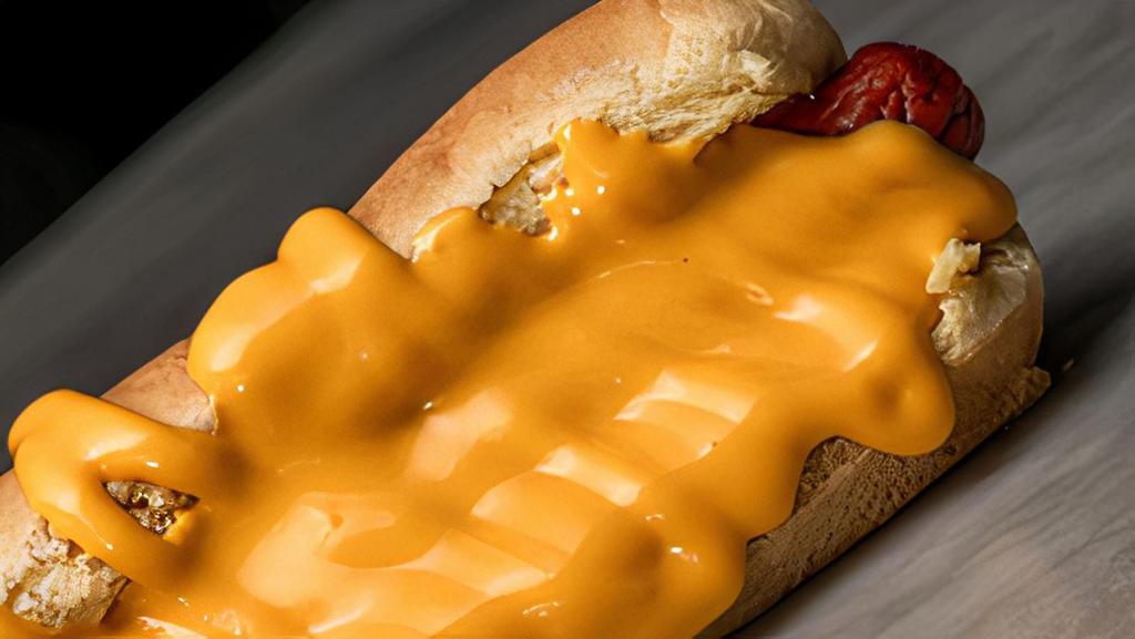 Cheese Dog · Potato roll with Feltman's hotdog, melted nacho cheese sauce.