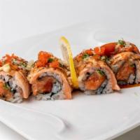 Crazy Salmon Roll · Spicy salmon roll on top with seared salmon, spicy mayo and tobiko crunch, eel sauce.