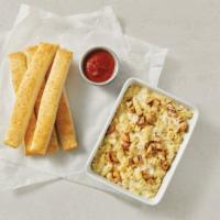 Chicken Alfredo · Grilled chicken and rotini oven-baked in our alfredo sauce. 950 cal. per pan.