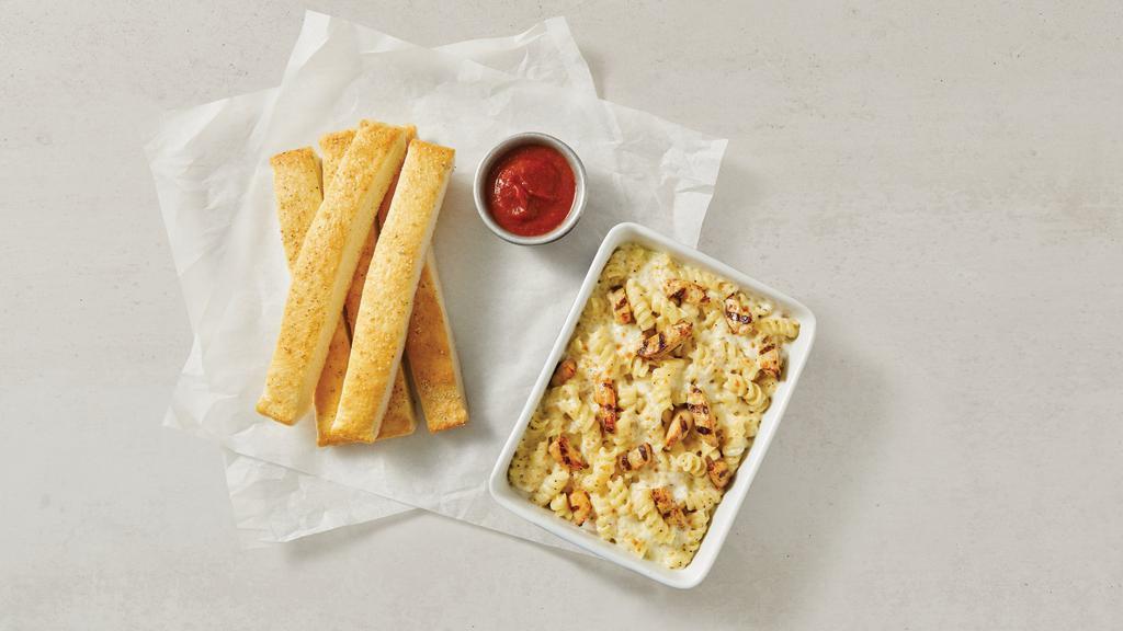 Chicken Alfredo · Grilled chicken and rotini oven-baked in our alfredo sauce. 950 cal. per pan.