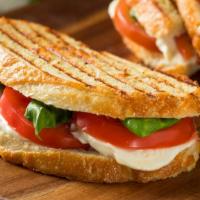 Mediterranean Panini · Yummy Hummus & olives with roasted peppers grilled zucchini, eggplant & fresh mozzarella wit...