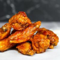 12 Classic Bone-In Wings · 12 Classic bone-in chicken wings tossed in 1 wing sauce and served with fresh carrot & celer...