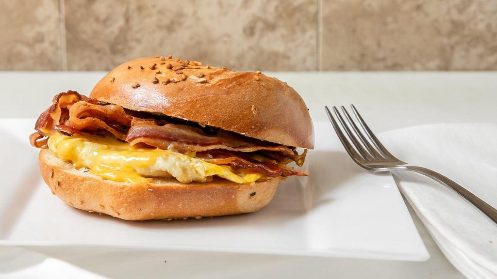Bacon, Egg, & Cheese Sandwich · Three crispy bacon, egg and American Cheese. No cheese order, we will add an extra strip of bacon.