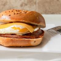 Taylor Ham, Egg, & Cheese Sandwich · Three slices of taylor ham, egg and American cheese.