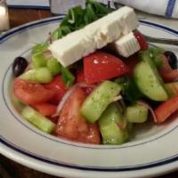Horyatiki Salad · Tomato, cucumber, feta, olives, green peppers, and red onions served with an extra virgin ol...