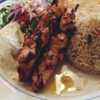 Chicken Souvlaki · Skewers of grilled marinated chicken served over rice pilaf or french fries with grilled pita.