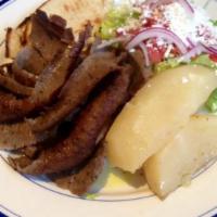 Gyro Platter
 · Lamb-beef gyro served with lettuce, tomatoes, onions  and feta cheese over rice pilaf or fre...
