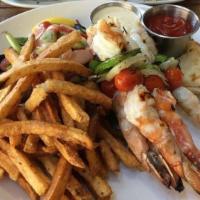 Shrimp Souvlaki · Skewers of grilled marinated shrimp served over rice pilaf or french fries with grilled pita.