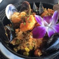 Arroz Con Mariscos · Prawns, bay scallops, clams, mussels and saffron scented yellow rice.