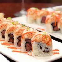 Surf & Turf Roll · Inside: grilled skirt steak; top: lobster and shrimp salad, horseradish and spicy mayo.