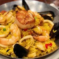 Thom Thom Seafood Paella · Diver scallop, wild shrimp, calamari, all natural chicken, PEI mussels, chorizo.
