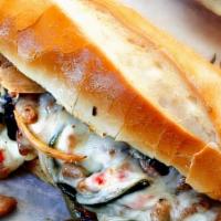 Philly Cheesesteak · Fresh sliced ribeye with melted cheese on a toasted Italian roll.Comes wıth French fries and...