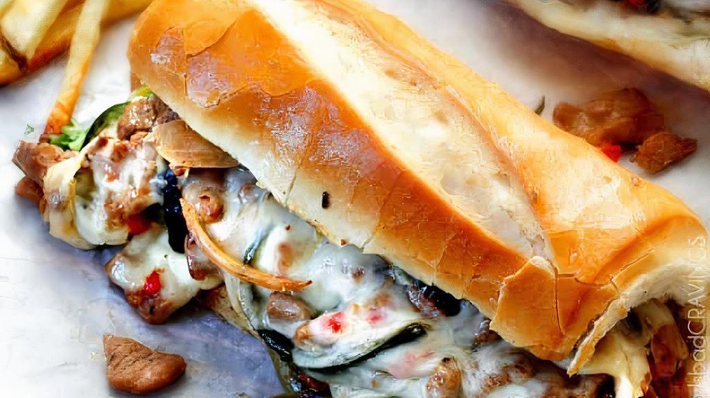 Philly Cheesesteak · Fresh sliced ribeye with melted cheese on a toasted Italian roll.Comes wıth French fries and sauces