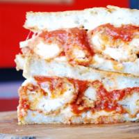 Chicken Parmesan Grilled Cheese · Crispy chicken strips and marinara sauce on a parmesan-crusted Mozzarella grilled cheese