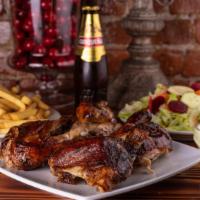 Pollo Al Carbon · A Rotisserie chicken cooked in our traditional brick oven with wood and charcoal. Accompanie...