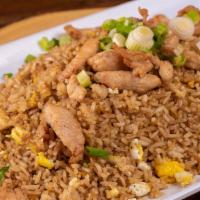 Chaufa De Pollo · A Chinese-Peruvian chicken and eggs fried rice fusion. Topped with scallions.